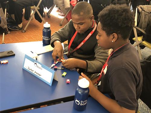 students putting puzzle together 